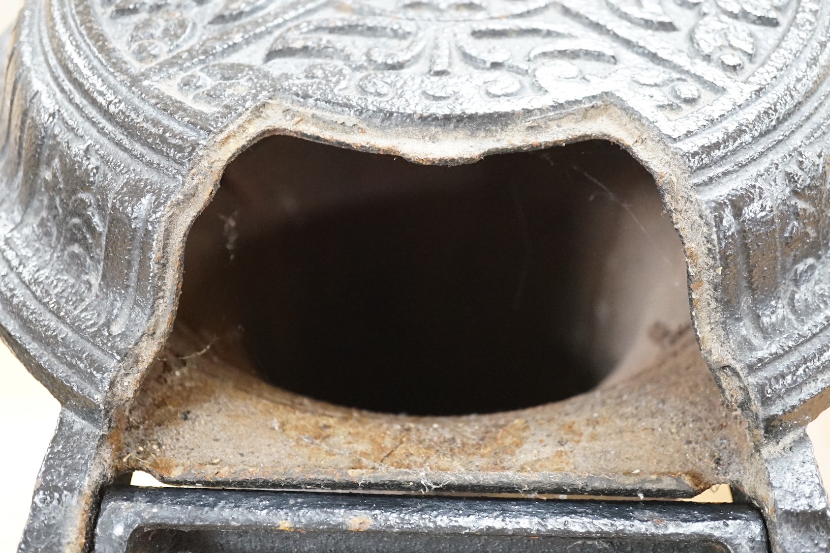 A black cast iron stove - 'The Slogan Stove’, 58cm high
